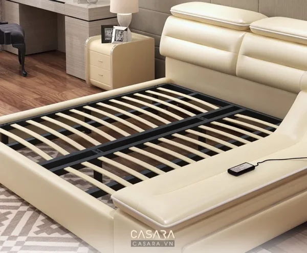 Giường ngủ hiện đại, sang trọng với thiết kế tinh tế, màu kem ấm áp.