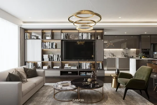 Phòng khách hiện đại, sang trọng với kệ sách lớn và TV.