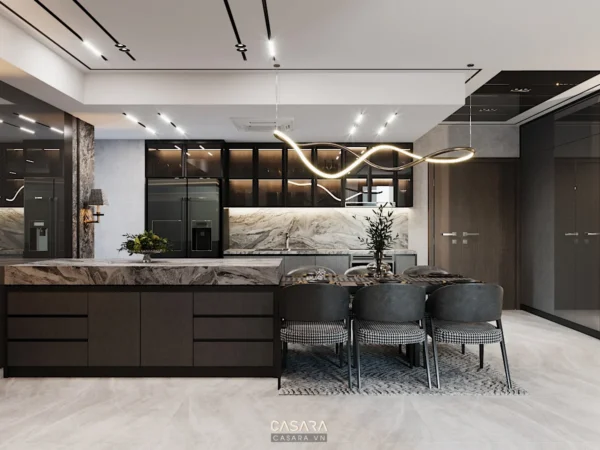 Phòng bếp hiện đại, sang trọng với đảo bếp lớn và đèn thả độc đáo.