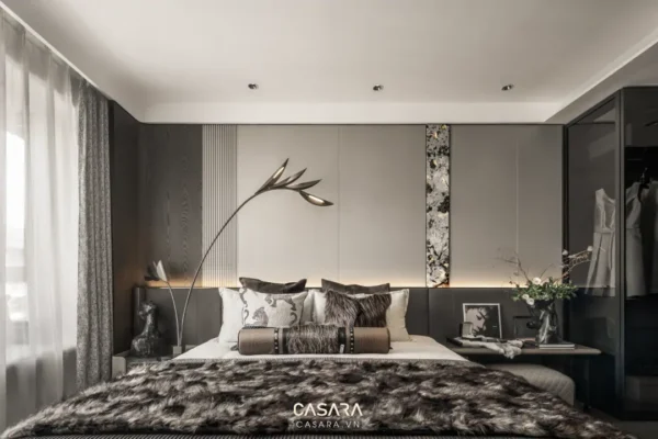 Phòng ngủ sang trọng, hiện đại với tông màu xám chủ đạo, ánh sáng ấm áp.