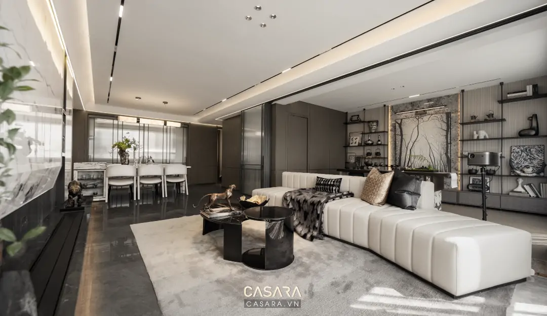 Phòng khách rộng được trang trí đẹp với sofa lớn, thảm và vách tivi
