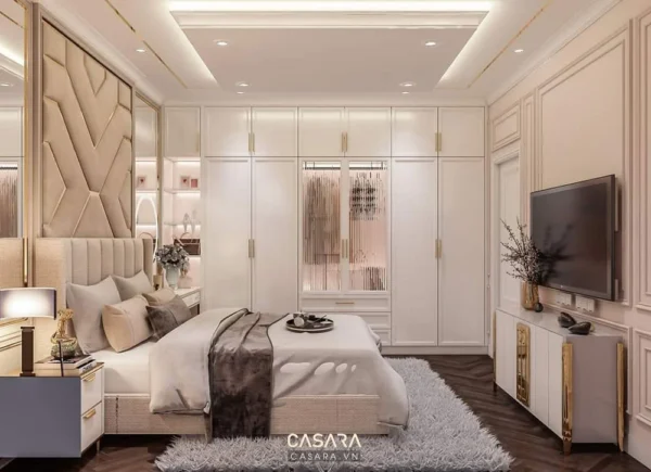 Phòng ngủ hiện đại, sang trọng với tủ âm tường và TV.