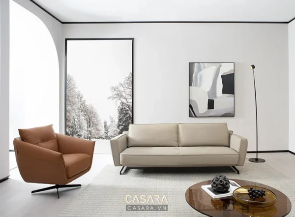 Phòng khách hiện đại, tối giản với ghế sofa da và tranh nghệ thuật.