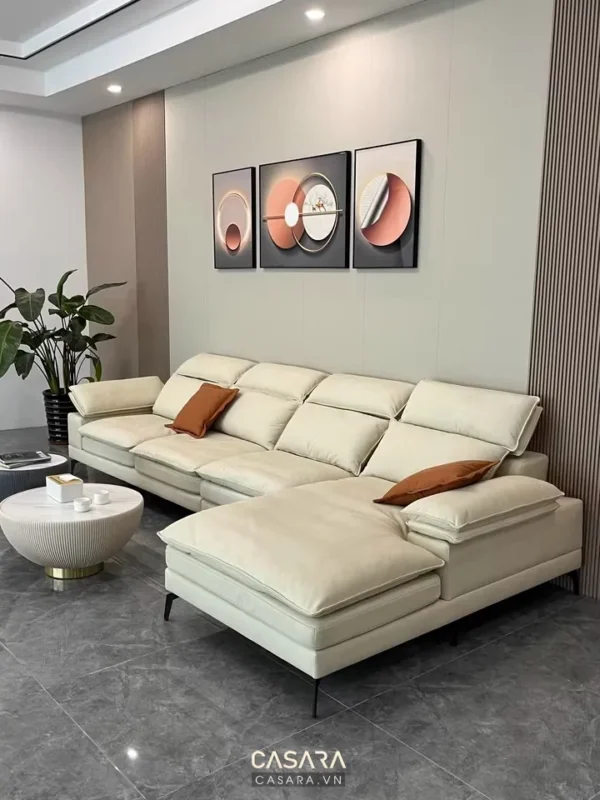 Phòng khách hiện đại với bộ sofa góc và tranh treo tường nghệ thuật.