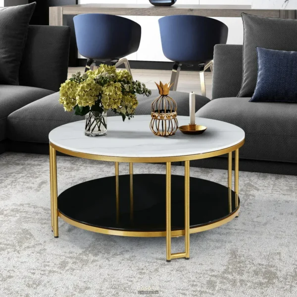 Phòng khách hiện đại với sofa xám, bàn tròn và hoa trang trí.