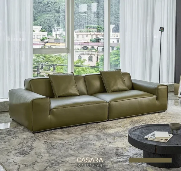 Phòng khách sang trọng với sofa da xanh rêu hiện đại.