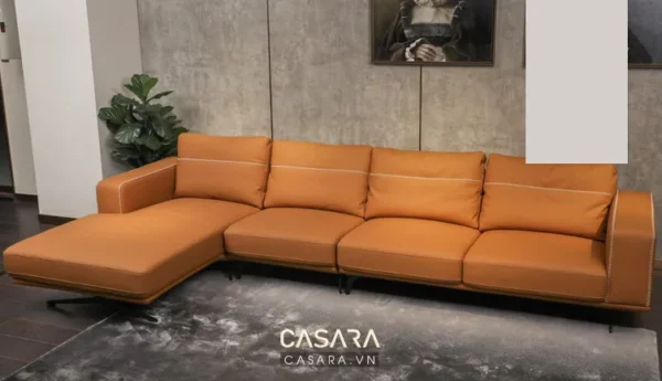 Bộ sofa góc da cam hiện đại, sang trọng trong không gian nội thất.
