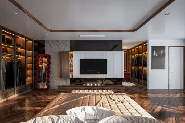 Phòng ngủ hiện đại, rộng rãi với tủ âm tường và TV lớn.