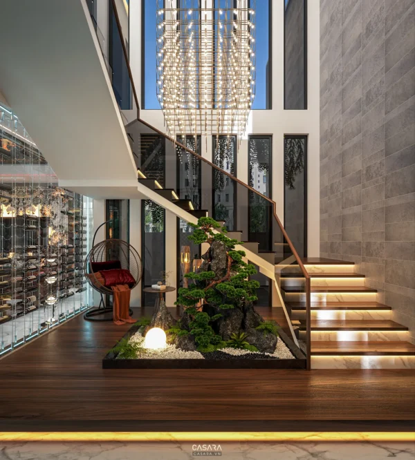 Nội thất sang trọng với cầu thang gỗ và tiểu cảnh cây xanh độc đáo.