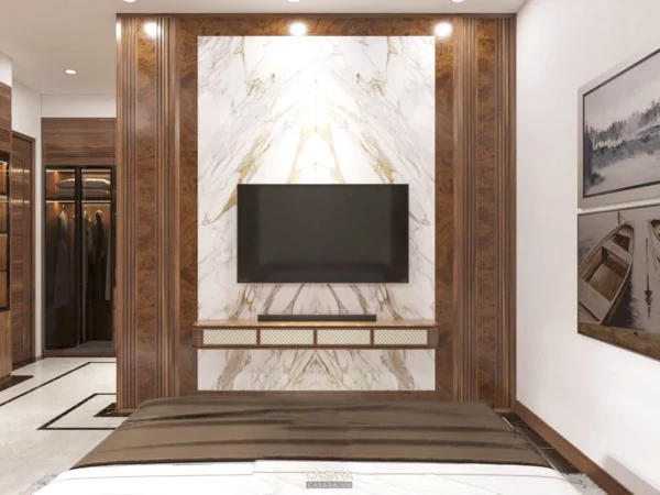 Phòng ngủ sang trọng với TV lớn và thiết kế nội thất hiện đại.