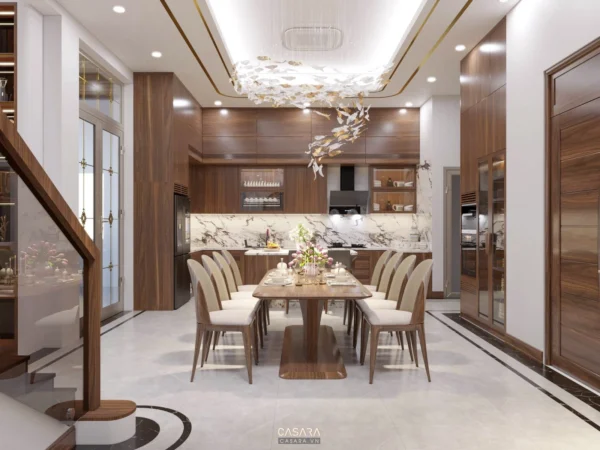 Phòng bếp-ăn hiện đại, sang trọng với nội thất gỗ và ánh sáng ấm áp.