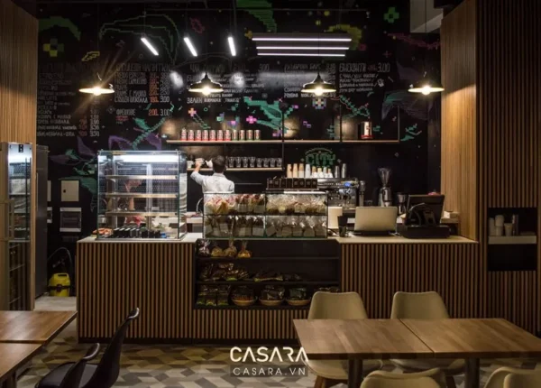 Quán cà phê hiện đại với thiết kế độc đáo, tông màu tối ấm cúng.