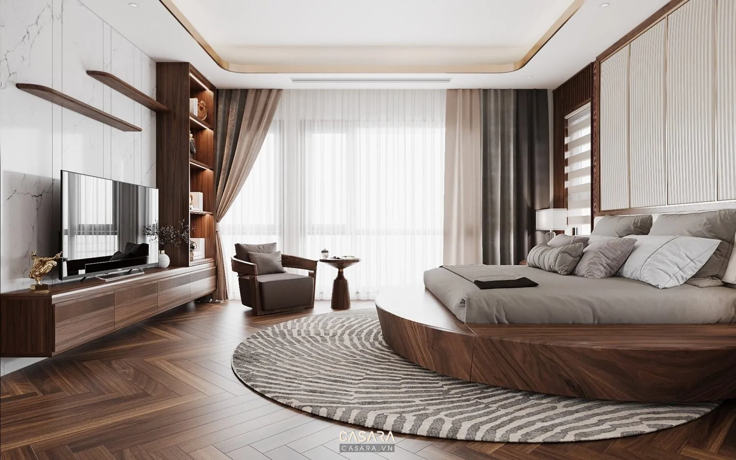 Căn hộ studio có sofa quay lưng giường ngủ, thảm phòng khách, kệ thấp phân vùng, tủ áo cao kịch trần, bếp nhỏ gọn và ánh sáng ban công