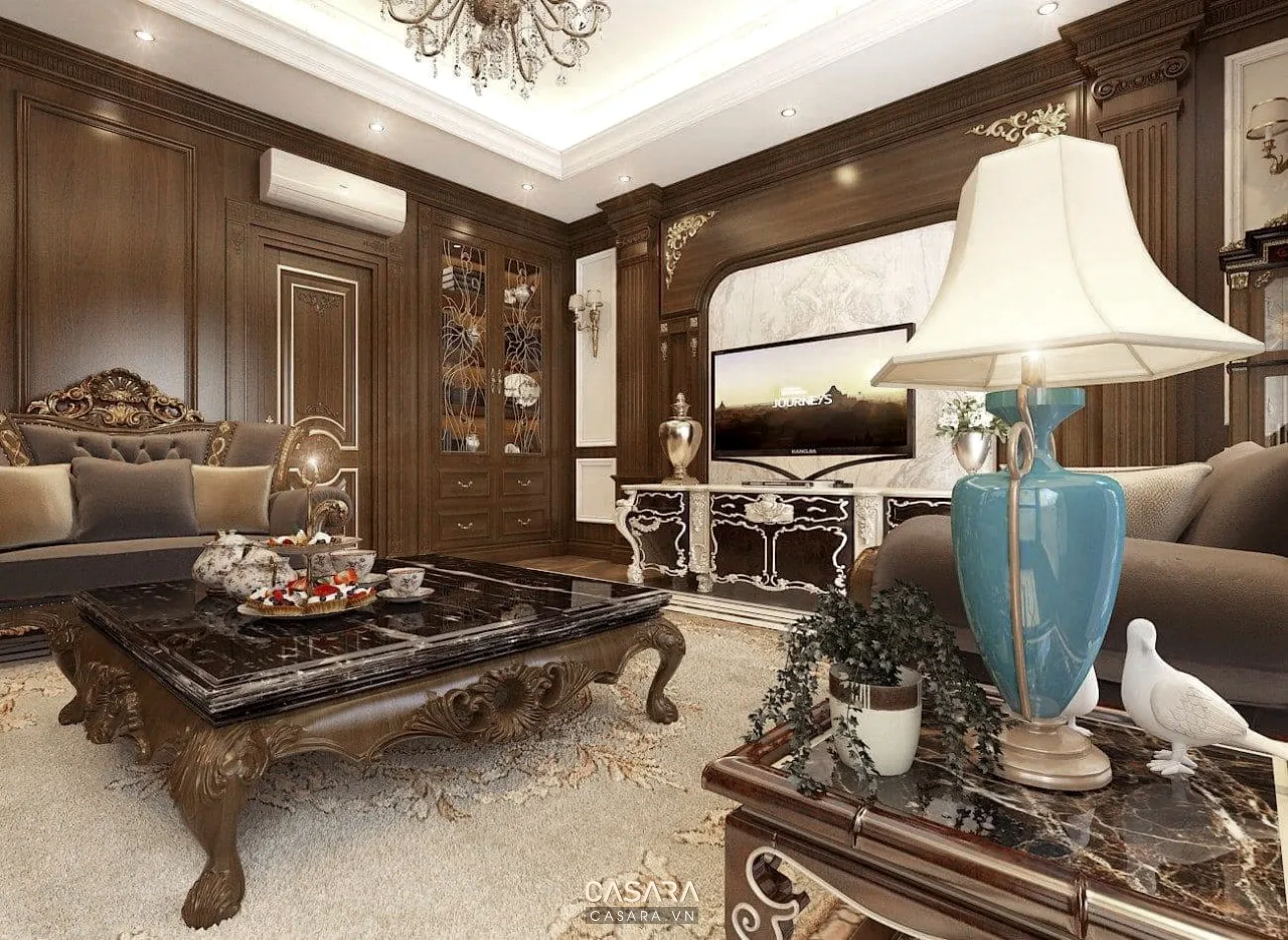 Cách trang trí phòng khách rộng với sofa chữ L thảm lớn và vách tivi hiện đại