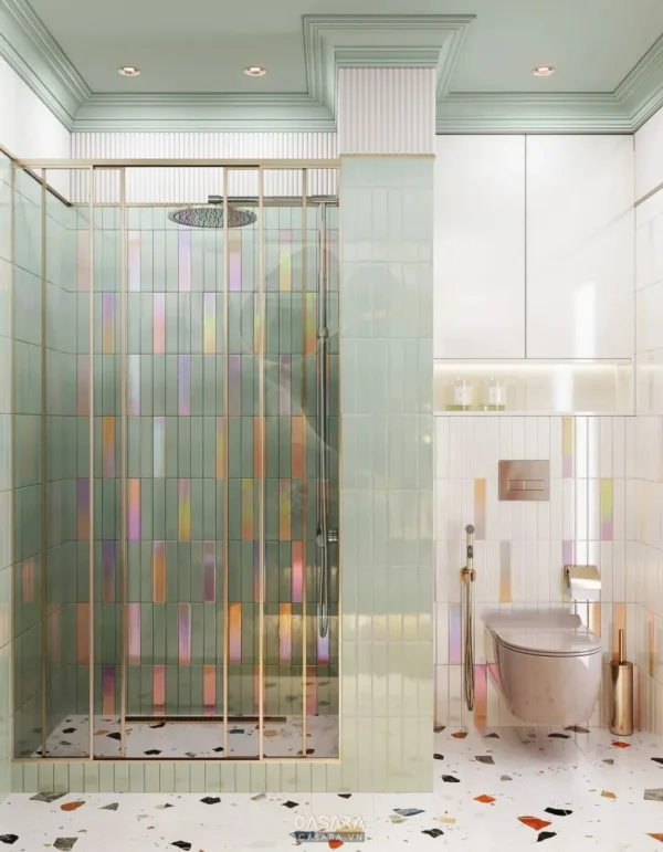 Phòng tắm hiện đại với vách kính màu sắc nổi bật và sàn gạch terrazzo.