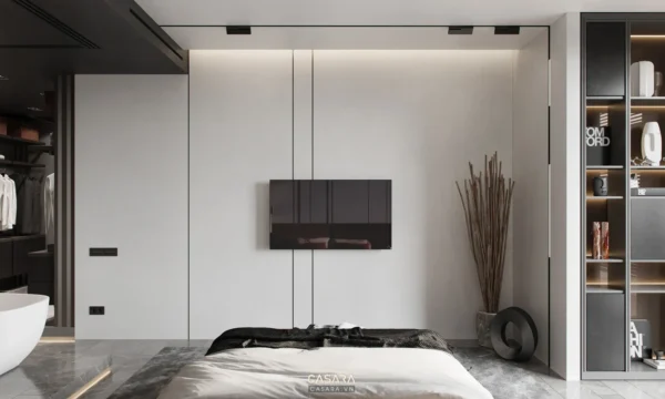 Phòng ngủ tối giản, hiện đại với tường trắng và tủ âm tường lớn.