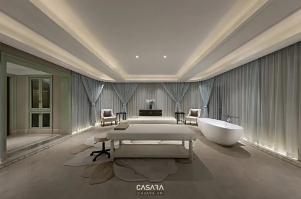 Phòng ngủ sang trọng với tông màu xanh, trắng tinh tế và ánh sáng dịu nhẹ.