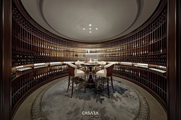 Phòng chứa rượu hình bán nguyệt sang trọng với bàn tròn ở trung tâm.