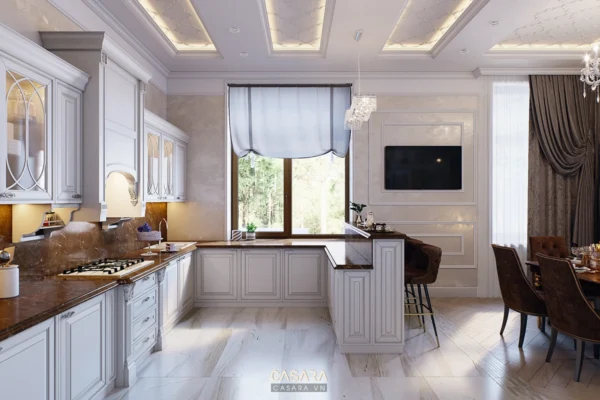 Phòng bếp và phòng ăn sang trọng, nội thất trắng chủ đạo.