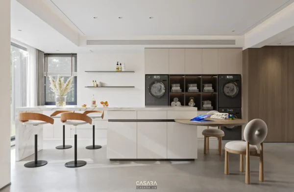 Phòng bếp hiện đại, tối giản với đảo bếp trung tâm và ghế bar.