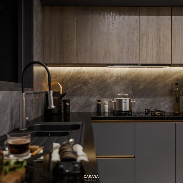 Khu bếp hiện đại, tối giản với ánh sáng vàng ấm áp, tinh tế.