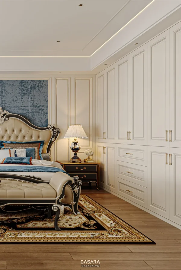 Phòng ngủ tân cổ điển sang trọng với giường và tủ trắng tinh tế.