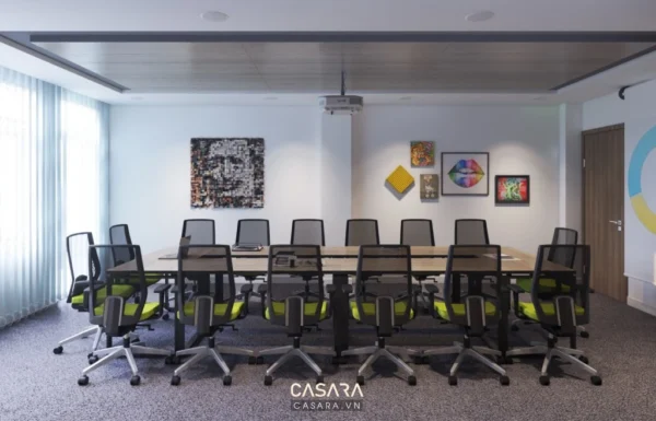 Phòng họp hiện đại với bàn dài, ghế đen và tranh treo tường.