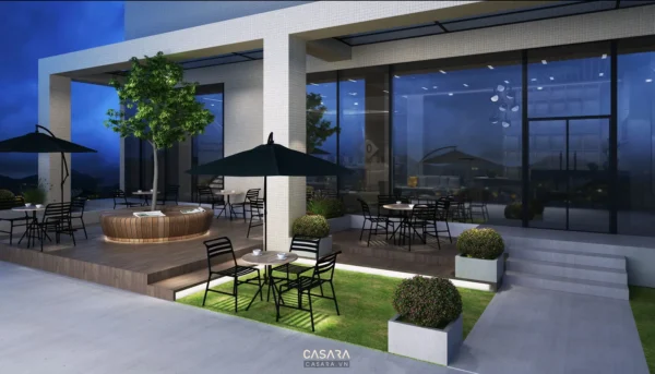 Khu vực ngoài trời sang trọng của quán cà phê với cây xanh và bàn ghế.