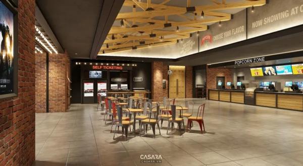 Sảnh rạp chiếu phim hiện đại với khu bán vé tự động và quầy popcorn.