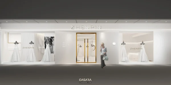 Kiến trúc cửa hàng Zhenpin sang trọng, tông trắng chủ đạo, ánh sáng dịu nhẹ.