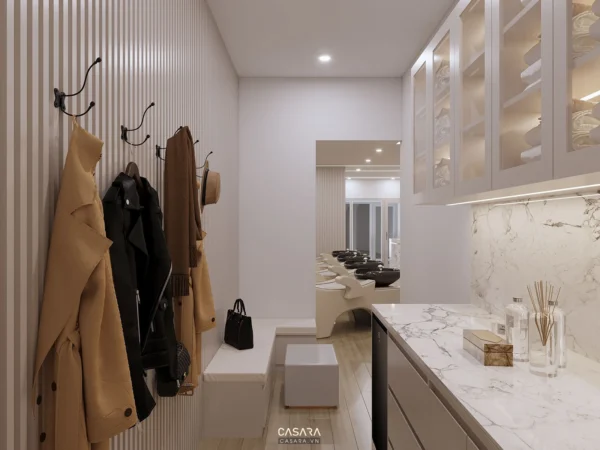 Khu vực sảnh đón tiếp và khu vực gội đầu trong một tiệm làm tóc hiện đại.