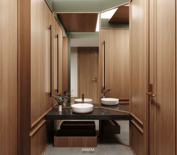 Phòng tắm hiện đại với bồn rửa mặt đôi và tủ gỗ sang trọng.