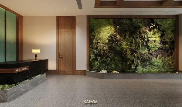 Sảnh đón tiếp sang trọng với tường cây xanh mát, hiện đại.
