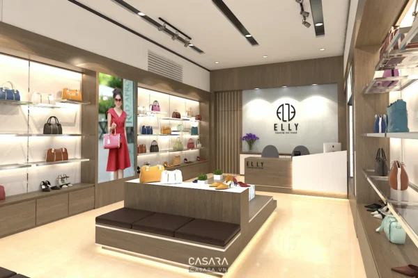 Showroom thời trang nữ có quầy tư vấn, bàn trưng bày trung tâm và hệ kệ sáng hai bên.