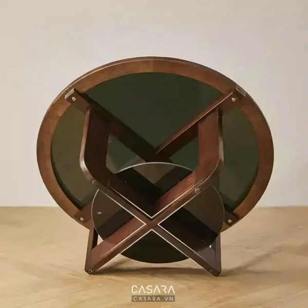Bàn tròn mặt kính, chân gỗ hình chữ X độc đáo, hiện đại.