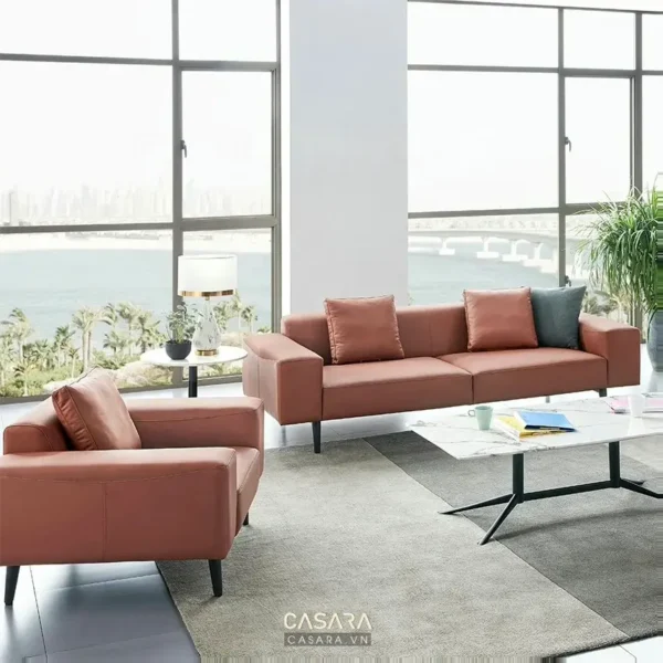 Phòng khách hiện đại với bộ sofa da màu cam đất tinh tế.
