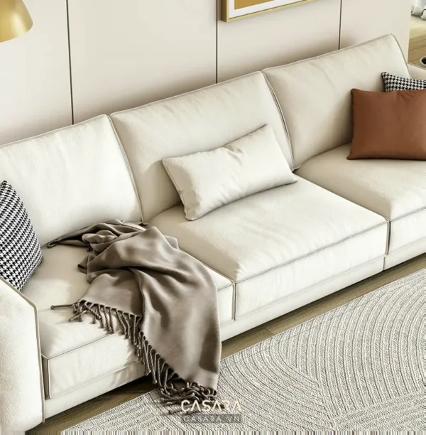 Bàn ghế sofa trắng hiện đại trong phòng khách.
