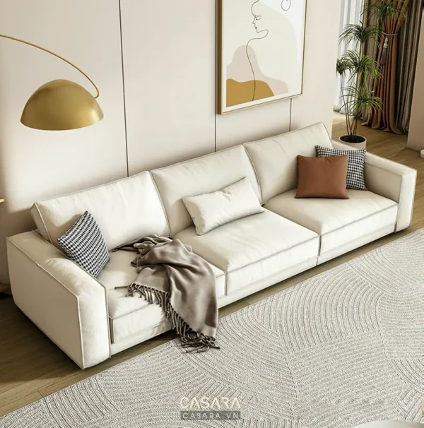 Phòng khách hiện đại với bộ sofa trắng lớn.