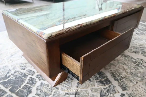 Bàn trà gỗ vuông vắn với mặt đá xanh, có ngăn kéo tiện lợi.