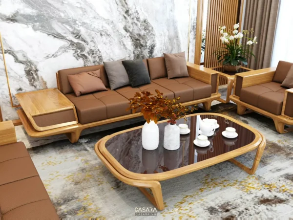 Phòng khách hiện đại với sofa da nâu, bàn trà kính và thiết kế nội thất sang trọng.