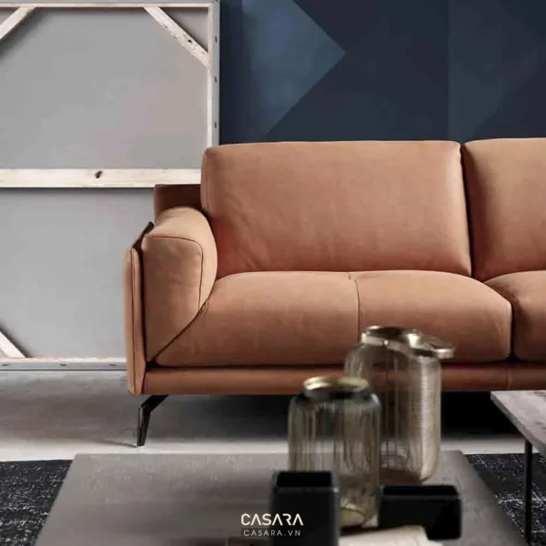 Ghế sofa da màu cam nâu hiện đại, sang trọng trong không gian nhà.