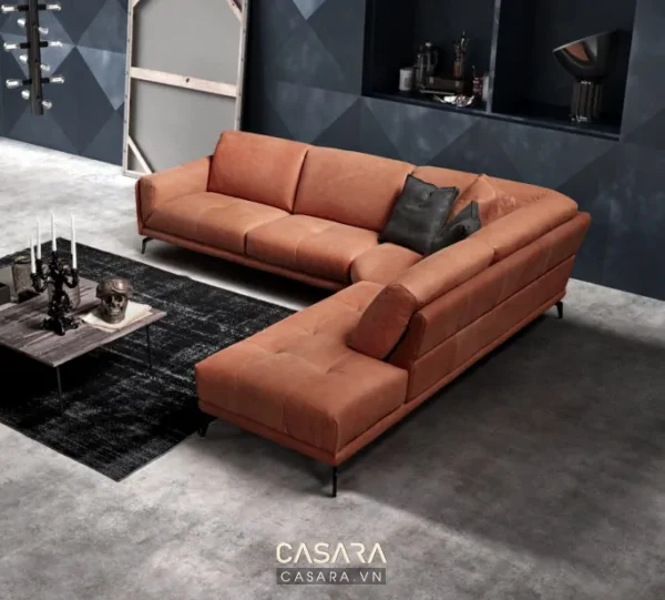 Bộ sofa góc da màu cam nổi bật trong không gian sống hiện đại.