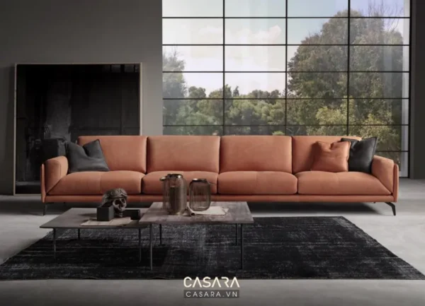 Phòng khách hiện đại với ghế sofa da màu cam nổi bật.