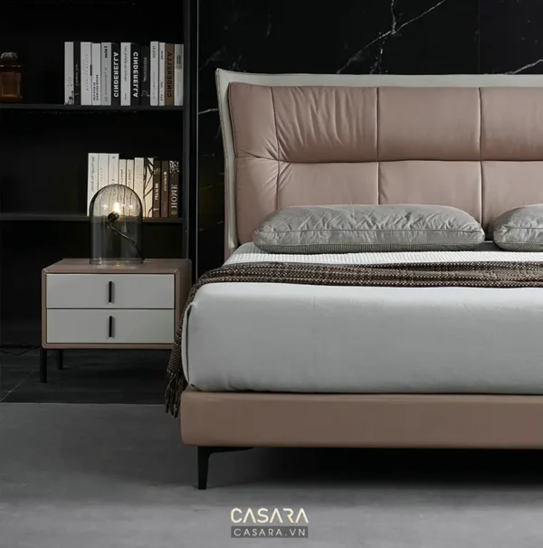 Giường ngủ hiện đại, sang trọng với tông màu hồng pastel dịu nhẹ.