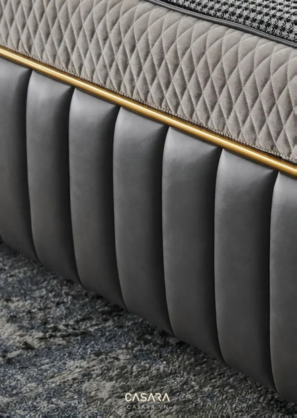 Đầu giường bọc da sang trọng với đường chỉ vàng tinh tế.