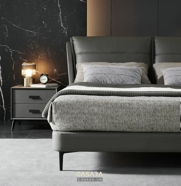 Phòng ngủ sang trọng với giường và tủ đầu giường hiện đại.