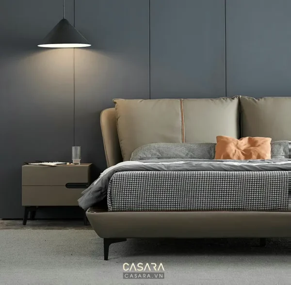 Phòng ngủ tối giản, sang trọng với giường và tủ đầu giường.