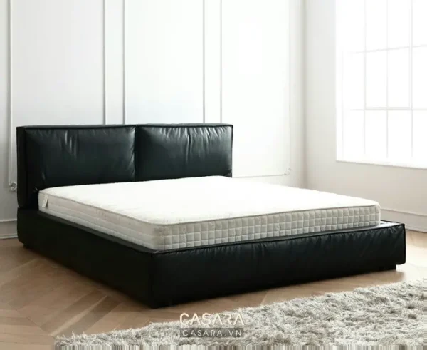 Giường ngủ da đen hiện đại, sang trọng với nệm trắng êm ái.