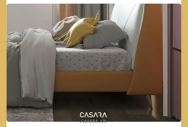 Giường ngủ hiện đại với gam màu cam ấm áp, tạo cảm giác thư giãn.