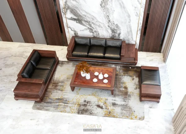 Phòng khách hiện đại với nội thất gỗ và da đen sang trọng.